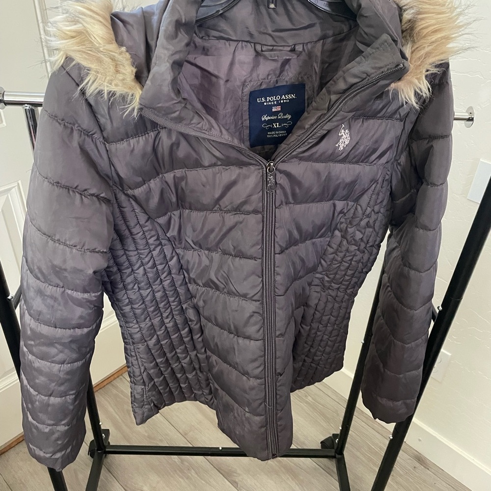 A grey Puffer jacket